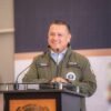 Fotografía simbólica de una balanza de justicia con el escudo de Michoacán y una línea ascendente que representa avances en investigación y denuncias