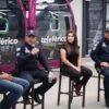 Multitud de personas corriendo en la Carrera 911 en Uruapan, con camisetas oficiales y letreros visibles sobre prevención de la extorsión
