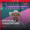 denuncia contra subsecretario: ilustración simbólica de una carpeta judicial con sello de la FEMDO y silueta de Uruapan al