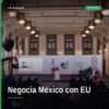 Fotografía simbólica de banderas de México y Estados Unidos junto a documento del T-MEC, representando que México negocia
