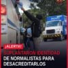 Jóvenes con siglas 'ENEF' pegadas con cinta adhesiva en ropa, en contexto de saqueo de camión en Zacapu, Michoacán —