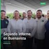 Abraham Espinoza Villa hablando ante público en evento del segundo informe en Buenavista, Michoacán, con logo del PVEM