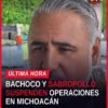 Fotografía simbólica de camiones de distribución estacionados frente a una bodega cerrada en Michoacán, con letrero