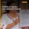 Belinda Iturbide Díaz frente a un micrófono en Puruándiro durante su registro diputación federal