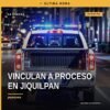Ilustración simbólica de una balanza y documentos legales con fondo azul, representando la vinculación a proceso jiquilpan